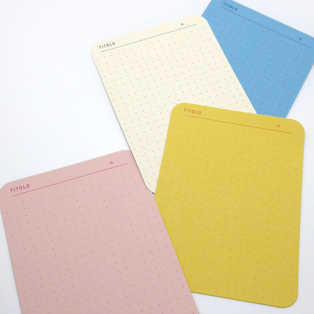 Individual dotted memo cards in pink, yellow, cream and blue